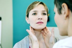 'woman getting checked for oral cancer'